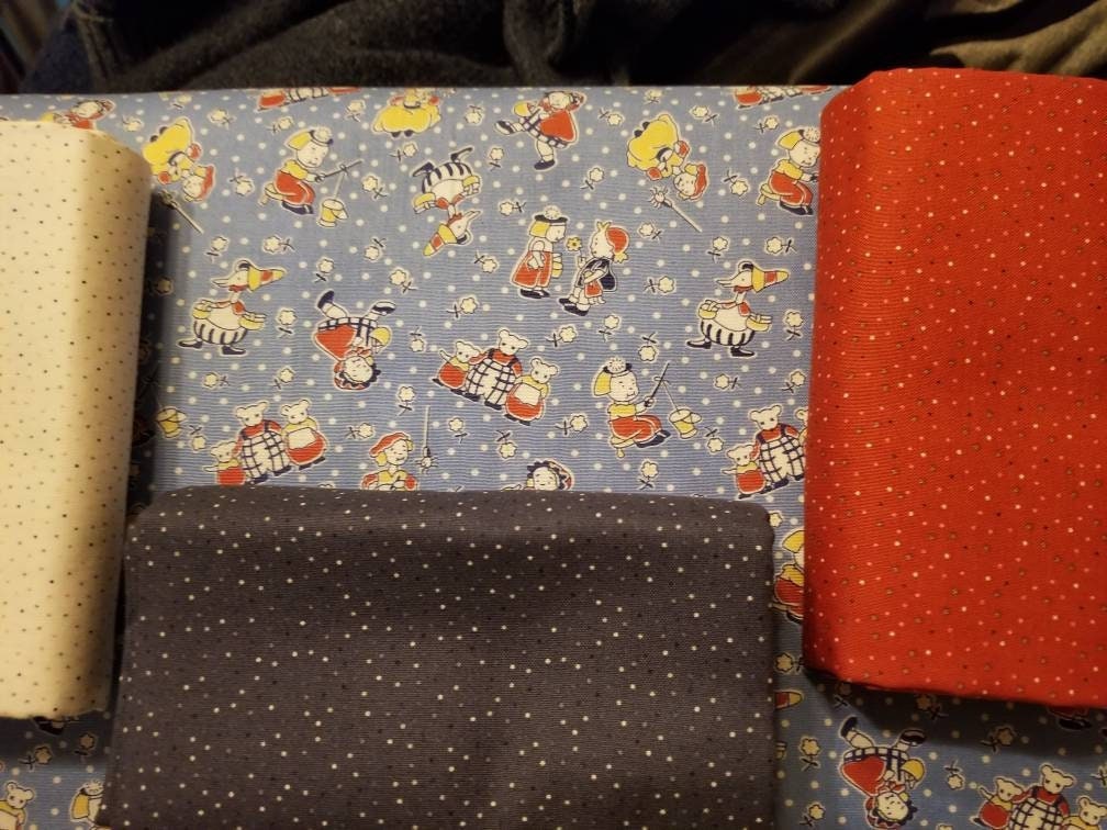 Story Time Mother Goose in Blue by Maywood Studio. Quilter's Cotton Fabric with vintage style for sewing. Continuous Cuts.