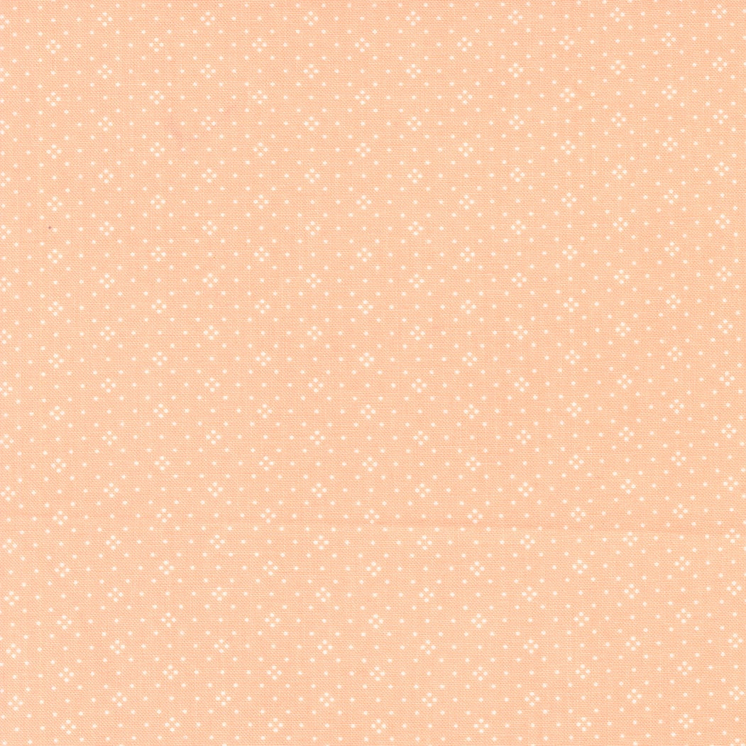 Eyelet in Cantaloupe by Fig Tree & Co for Moda Fabrics Basic Dot Foulard Shirting. Continuous cuts of Quilter's Cotton Fabric