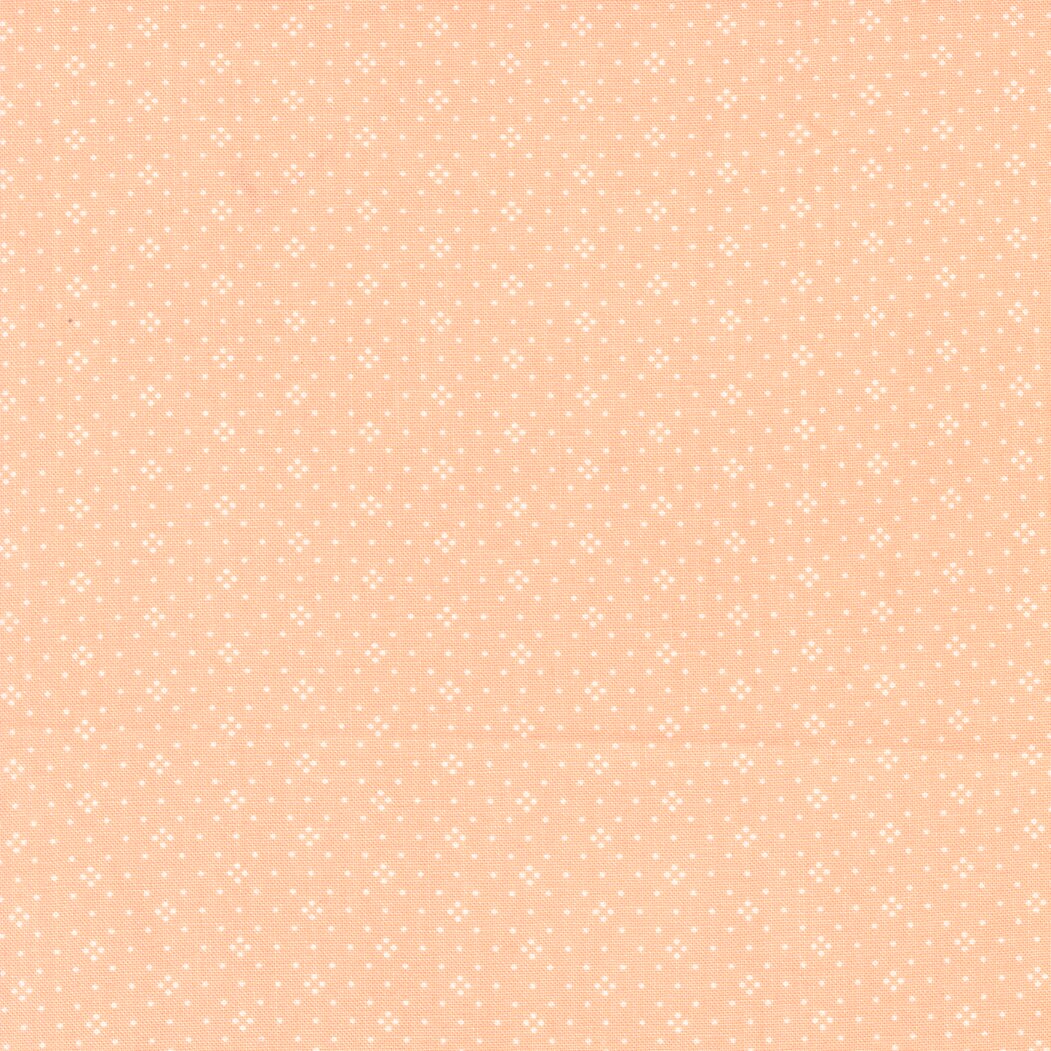 Eyelet in Cantaloupe by Fig Tree & Co for Moda Fabrics Basic Dot Foulard Shirting. Continuous cuts of Quilter's Cotton Fabric