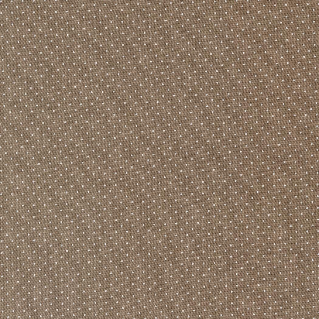 Enchantment Swiss Dot in Teak by Jackie MacDonald of Sweetfire Road for Moda. Continuous cuts of Quilter's Cotton