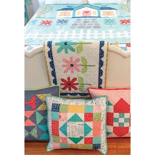 Quilter's Cottage 61 page soft cover spiral bound book by It's Sew Emma. Directions for 74.5 x 89 inch quilt and coordinating projects.