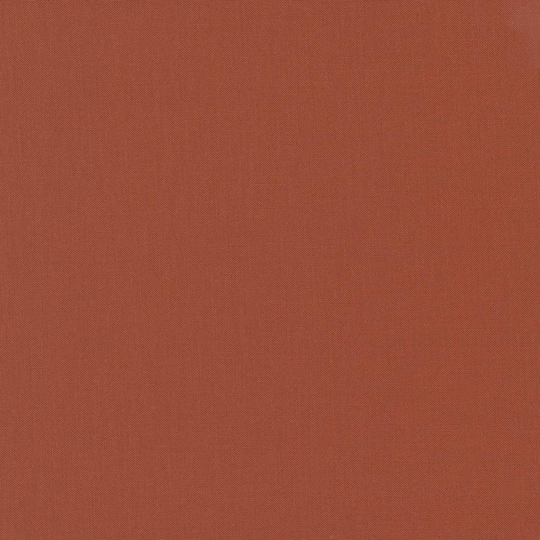 Bella Solids in Rust by Moda. Continuous cuts of Quilter's Cotton Fabric
