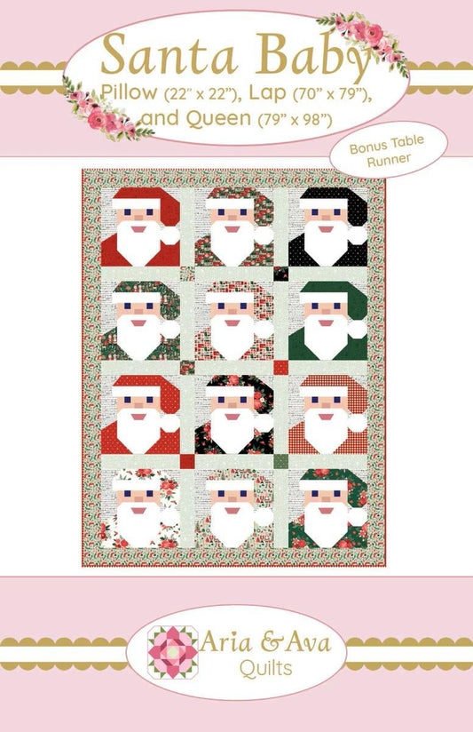 Santa Baby Quilt by Aria & Ava Quilts features pieced Santa heads. Pattern includes 22” x 22” pillow, 70” x 79” lap, and  79” x 98” Queen