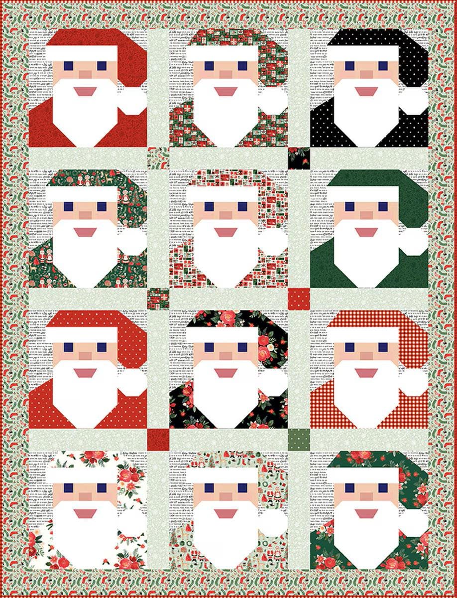 Santa Baby Quilt by Aria & Ava Quilts features pieced Santa heads. Pattern includes 22” x 22” pillow, 70” x 79” lap, and  79” x 98” Queen