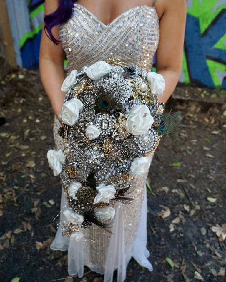 Stunning metallic cascading bridal bouquet with handmade satin roses and jewelry.