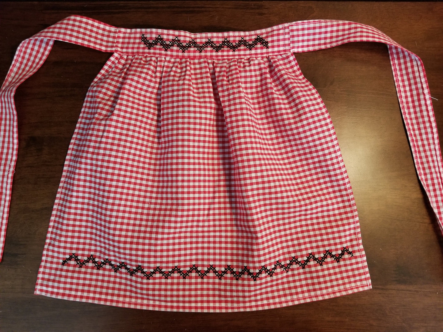 Red Gingham Child's Apron with Black Cross Stitch Accents