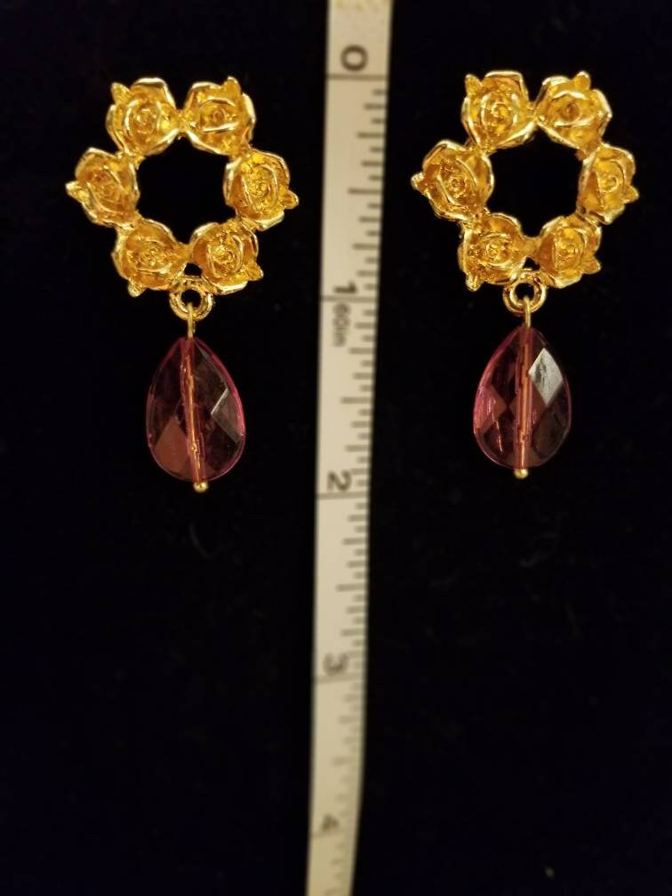 Elegant gold roses with pink teardrop earrings. A wreath of roses in gold, length with pink crystal teardrop is 2 inches.