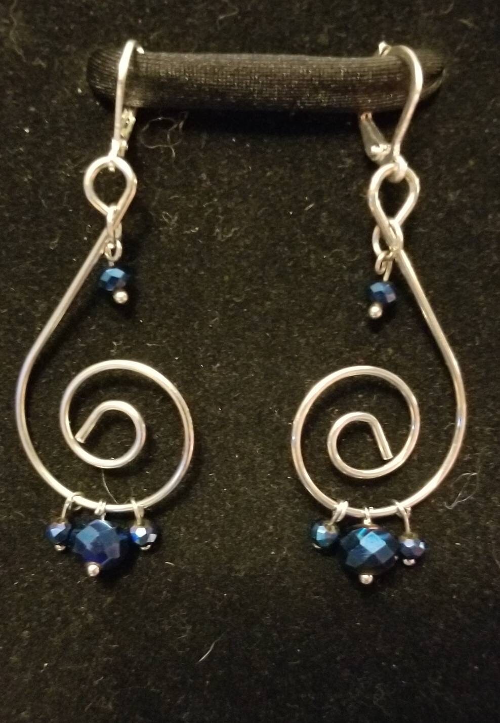 Silver and Navy swirly dangle earrings.  Super fun 2.75 inch drop for an eye catching statement!
