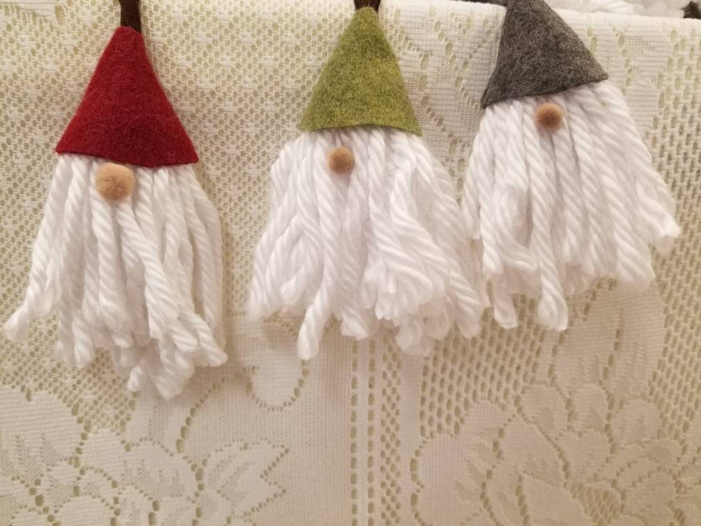 Gnome ornaments or doorknob hangers.  Darling little gnomes perfect to decorate with stretchy hanging loop.