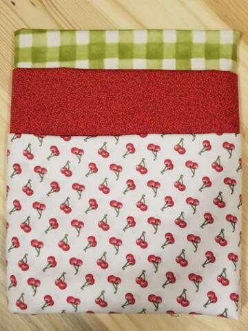 Let's Bake Cherry 3 yard quilt kit. One yard of each of 3 coordinating fabrics perfect for a quick and easy quilt.