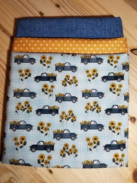 Heartland Country Road Trucks in Blue 3 yard quilt kit. One yard of each of 3 coordinating fabrics perfect for a quick and easy quilt.