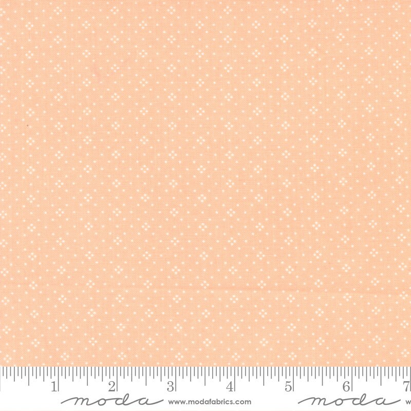 Eyelet in Cantaloupe by Fig Tree & Co for Moda Fabrics Basic Dot Foulard Shirting. Continuous cuts of Quilter's Cotton Fabric